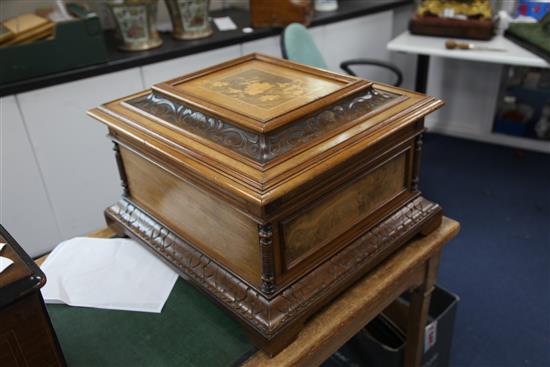 A 19th century walnut cased Polyphon musical box, with thirty six 15.5 inch discs, width 21.5in.